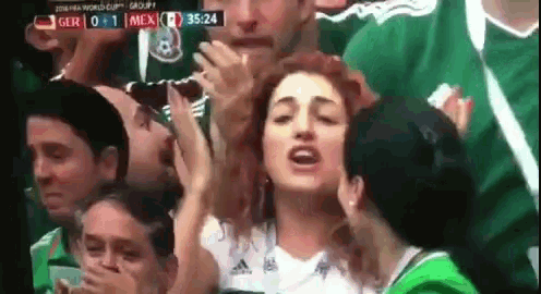 a group of people are watching a soccer game between mexico and ger