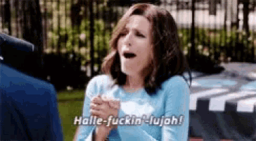 a woman in a blue shirt is saying halle fuckin ' lujah