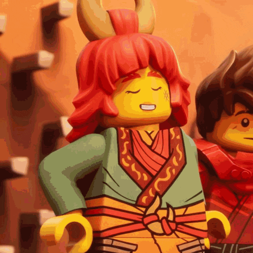 a lego character with red hair and horns is smiling