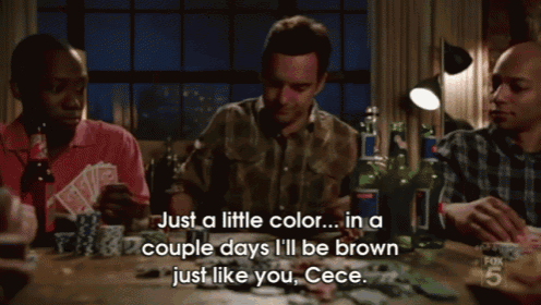 a shirtless man sits in a chair with a laptop and says just a little color in a couple days