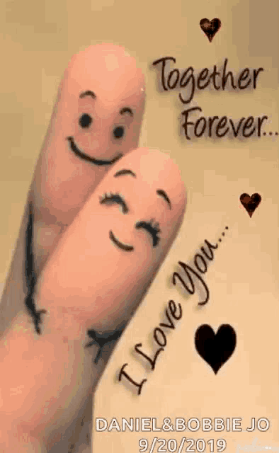 a couple of fingers with faces drawn on them and the words `` i love you '' .