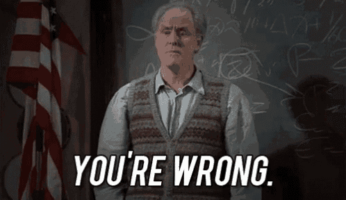 a man in a sweater vest is standing in front of a blackboard and says `` you 're wrong '' .