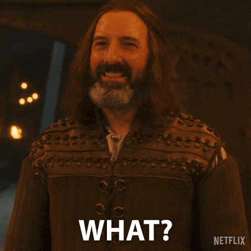 a man with long hair and a beard is asking what