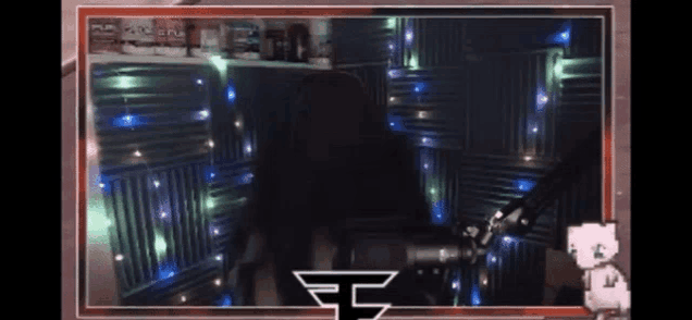 a person sitting in front of a microphone with a ff logo on the bottom right