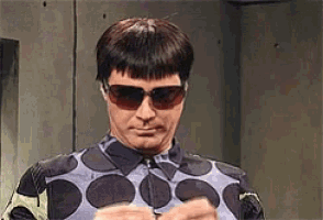 a man wearing sunglasses and a shirt with polka dots on it