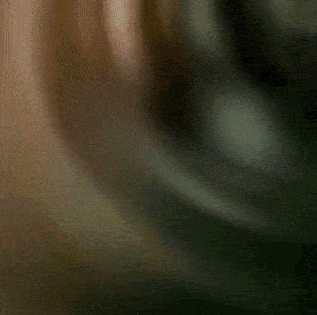 a blurry picture of a person 's face with a few spots of light on it