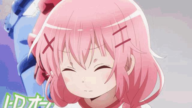 a girl with pink hair is making a face with her eyes closed