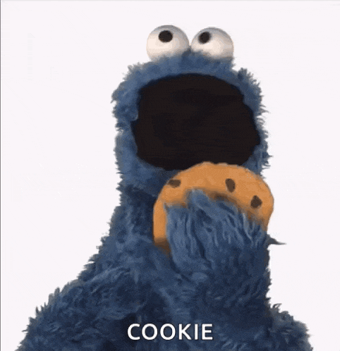 cookie monster from sesame street is covering his face with his paw .