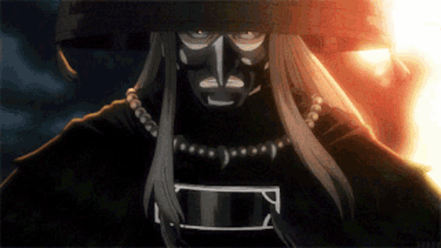 a man with long hair and a mask on his face is looking at the camera