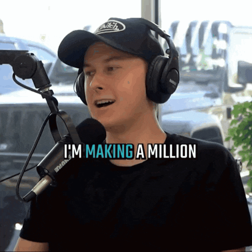 a man wearing headphones and a hat says i 'm making a million in front of a microphone