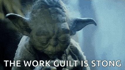 a close up of a statue of yoda with the words `` the work guilt is strong '' written above him .