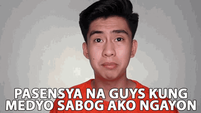 a young man in an orange shirt with the words pasensya na guys kung medyo sabog ako ngayon below him