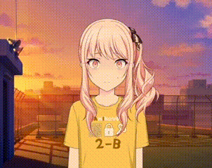 a girl with long blonde hair is wearing a yellow t-shirt with the number 2b on it .