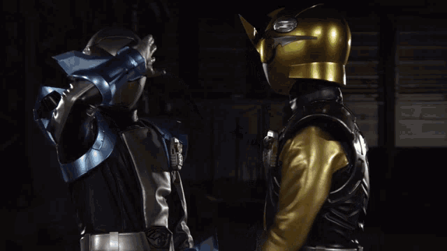 a man in a gold helmet holds another man 's hand