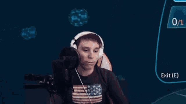 a man wearing headphones and an american flag shirt is sitting in front of a microphone in a video game .