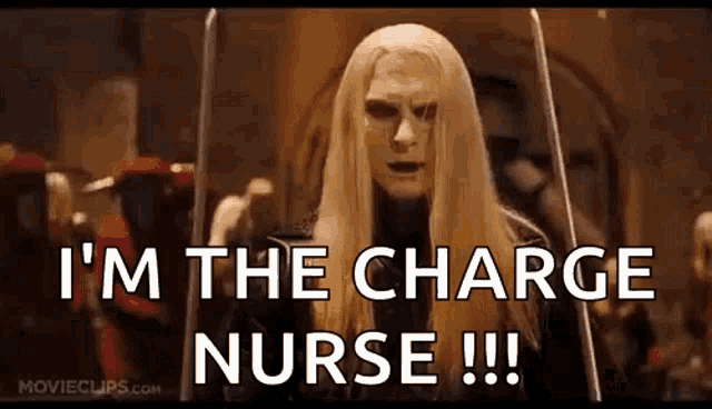 a man with long blonde hair and a mask is holding swords and saying `` i 'm the charge nurse !!! ''
