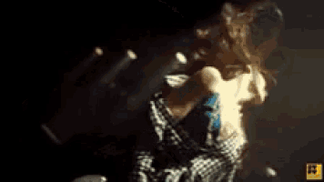 a man and a woman are swimming underwater in the dark .