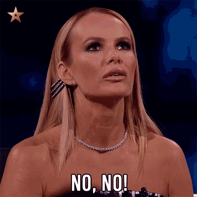 a woman with blonde hair and a necklace says " no no "