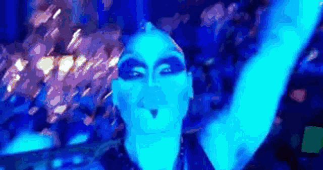 a person with blue makeup on their face