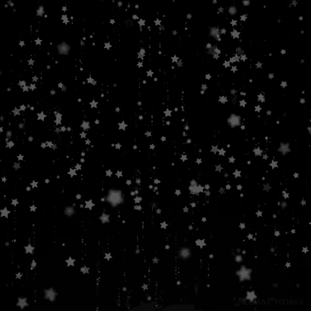 a black background with white stars falling down