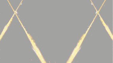 a glowing light is coming out of the center of a dark background