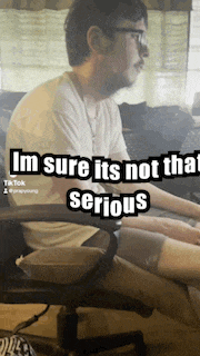 a man is sitting in a chair with the words i 'm sure it 's not that serious