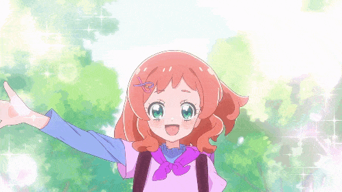 a girl with red hair and green eyes is wearing a pink shirt