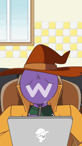 a purple cartoon character wearing a witch hat is sitting in front of a laptop