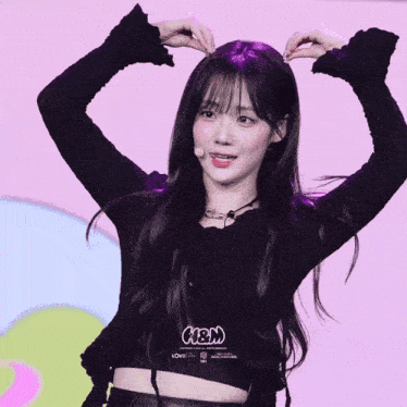 a girl wearing a black shirt that says n & m on it
