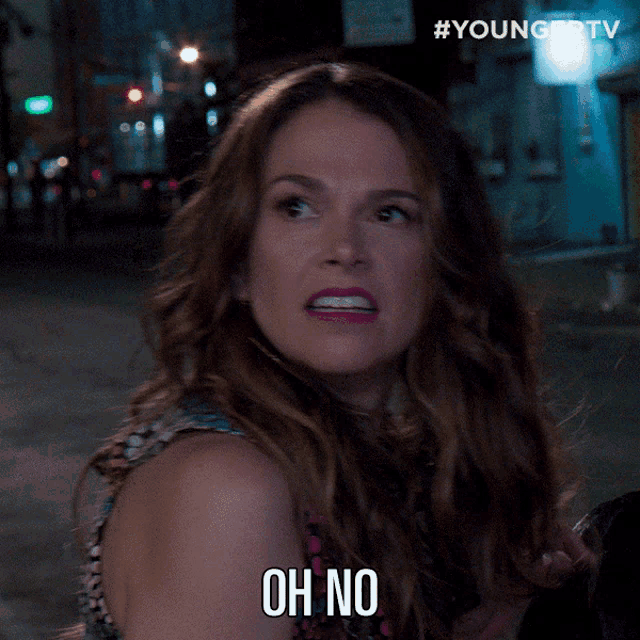 a woman says oh no in front of a younger tv sign