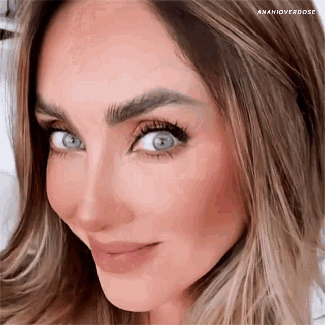 a close up of a woman 's face with anahioverdose written on the bottom right