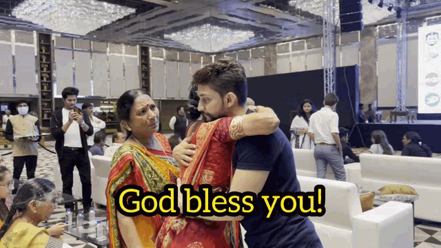 a man hugging a woman with the words god bless you written on the bottom