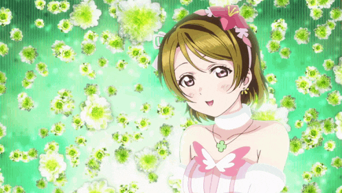 a girl in a white dress with a pink flower in her hair is surrounded by green flowers