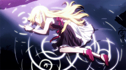 a girl in a black and white dress is laying on the ground with tokyo mx in the background