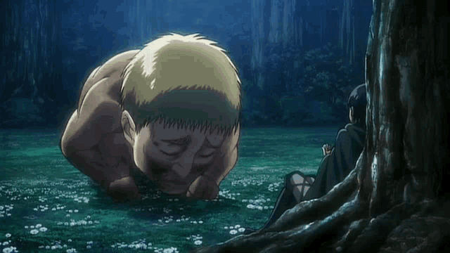 a man is sitting under a tree while a naked man crawls on the ground