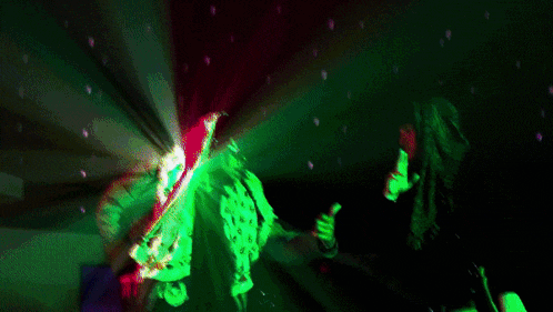 a painting of two people dancing in a dark room with a green and blue light behind them