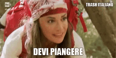 a woman wearing a red scarf and a backpack is smiling and says devi piangere .