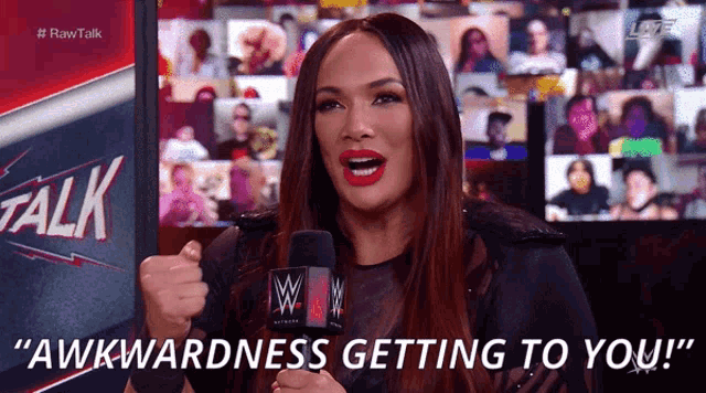 a woman with a microphone says awkwardness getting to you