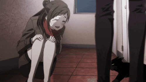 a girl is sitting on the floor with her legs crossed