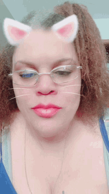 a woman wearing glasses and cat ears on her head
