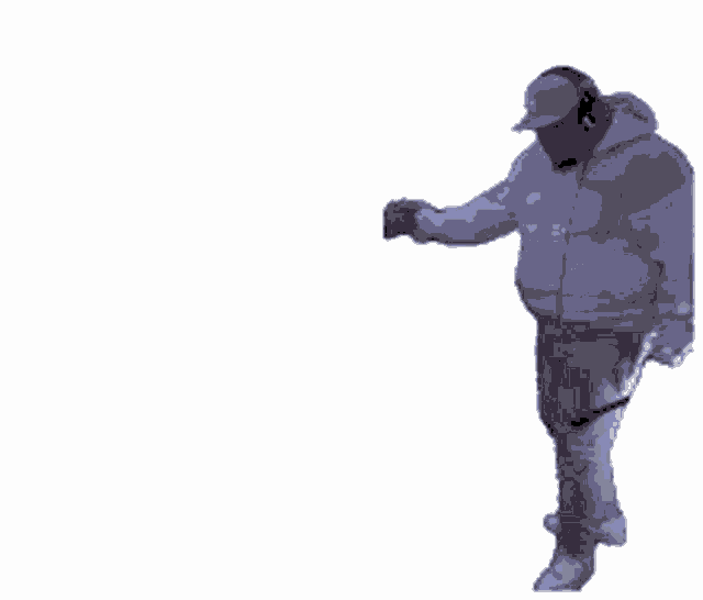 a man wearing a hat and a hoodie is dancing