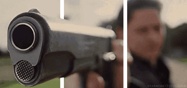 a man is pointing a gun at the camera in a 3d optical illusion .