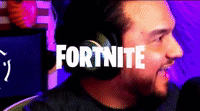 a man wearing headphones is talking into a microphone and the word fortnite is on the screen behind him .