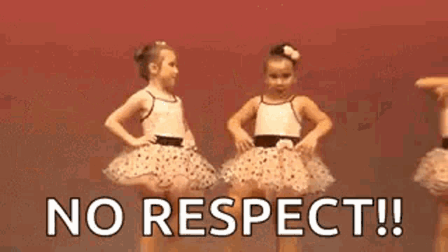 two little girls in tutus are dancing on a stage and the words `` no respect '' are behind them .