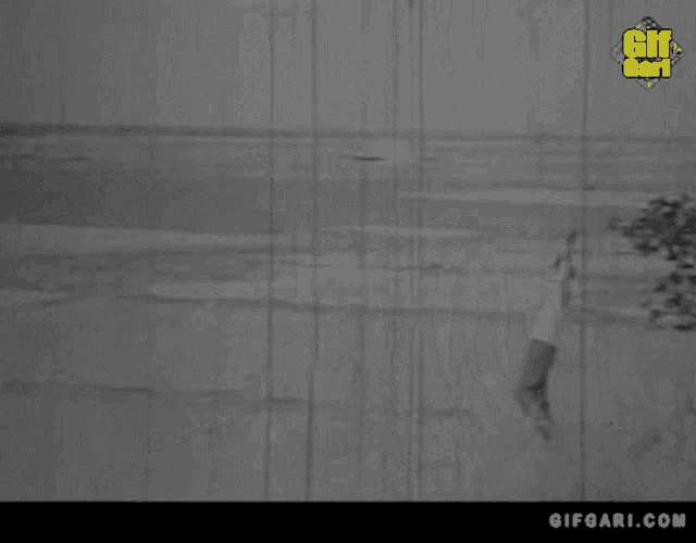 a black and white photo of a woman with a gifgari.com logo on the bottom