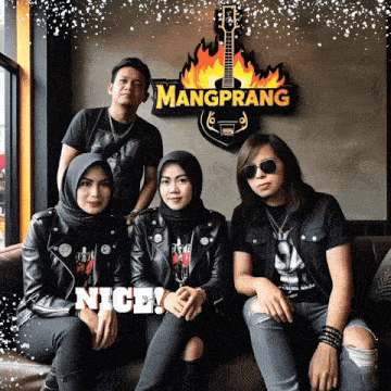 a group of people sitting in front of a sign that says mangprang