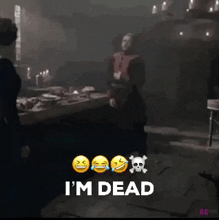 a man is standing in a dark room with skulls and crossbones and the words i 'm dead