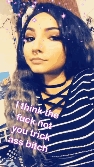 a woman in a striped shirt says i think the fuck not you trick ass bitch on her face
