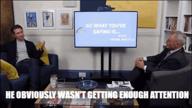 two men sit in front of a screen that says so what you 're saying is with peter whittle