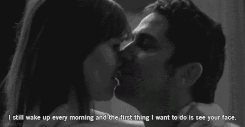 a black and white photo of a man and woman kissing with the caption i still wake up every morning and the first thing i want to do